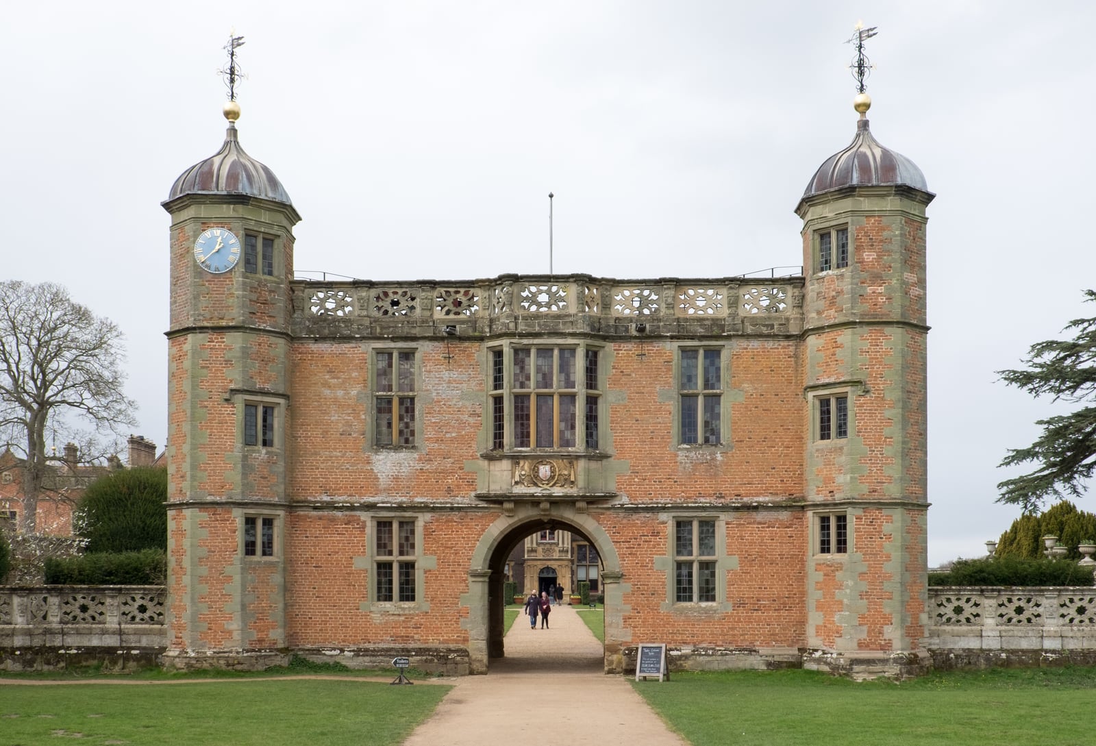 The Elizabethan brick gatehouse of Charlecote Park, Warwickshire, with two octagonal turrets.