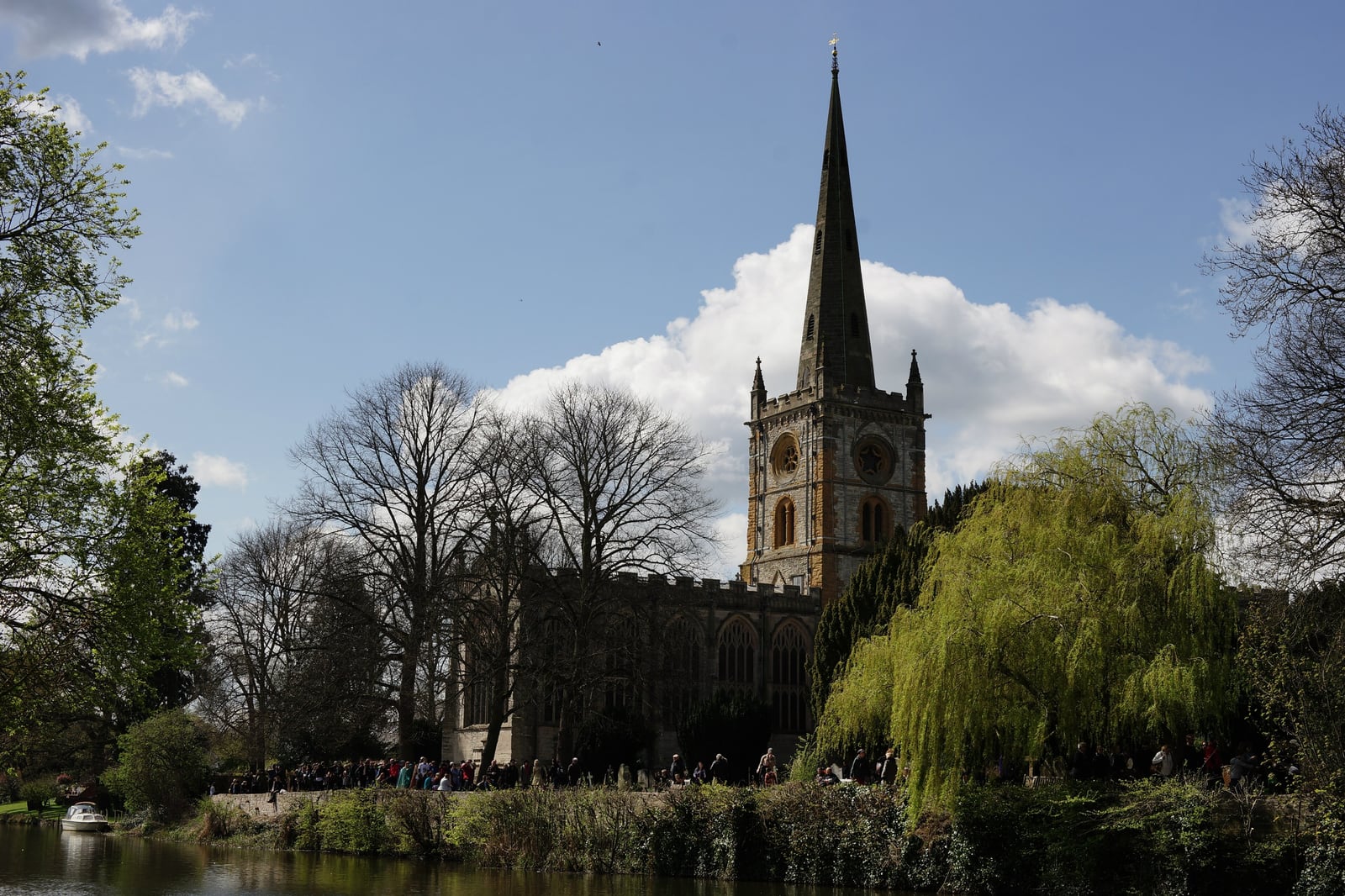 Holy Trinity Church, Stratford-upon-Avon, tower and spire seen across the River Avon in spring.