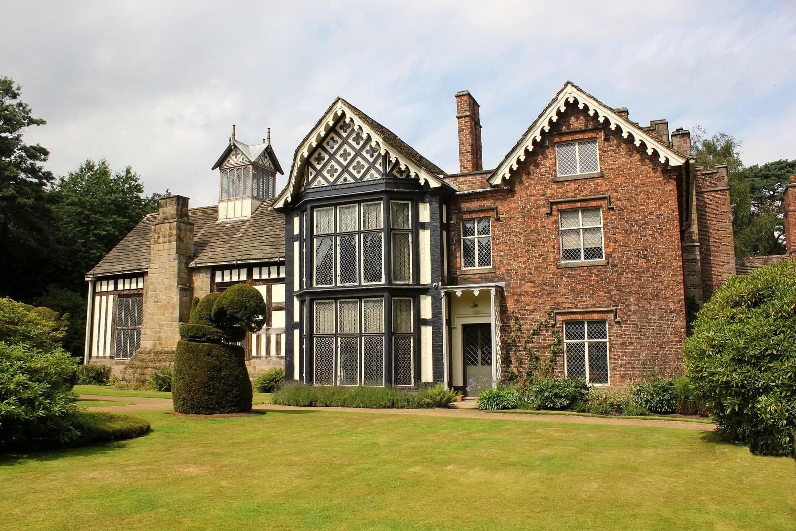 Rufford Old Hall, Lancashire: the timber-framed great hall with its bay window and a brick wing.